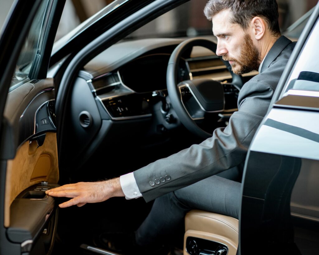 Man in a luxury car