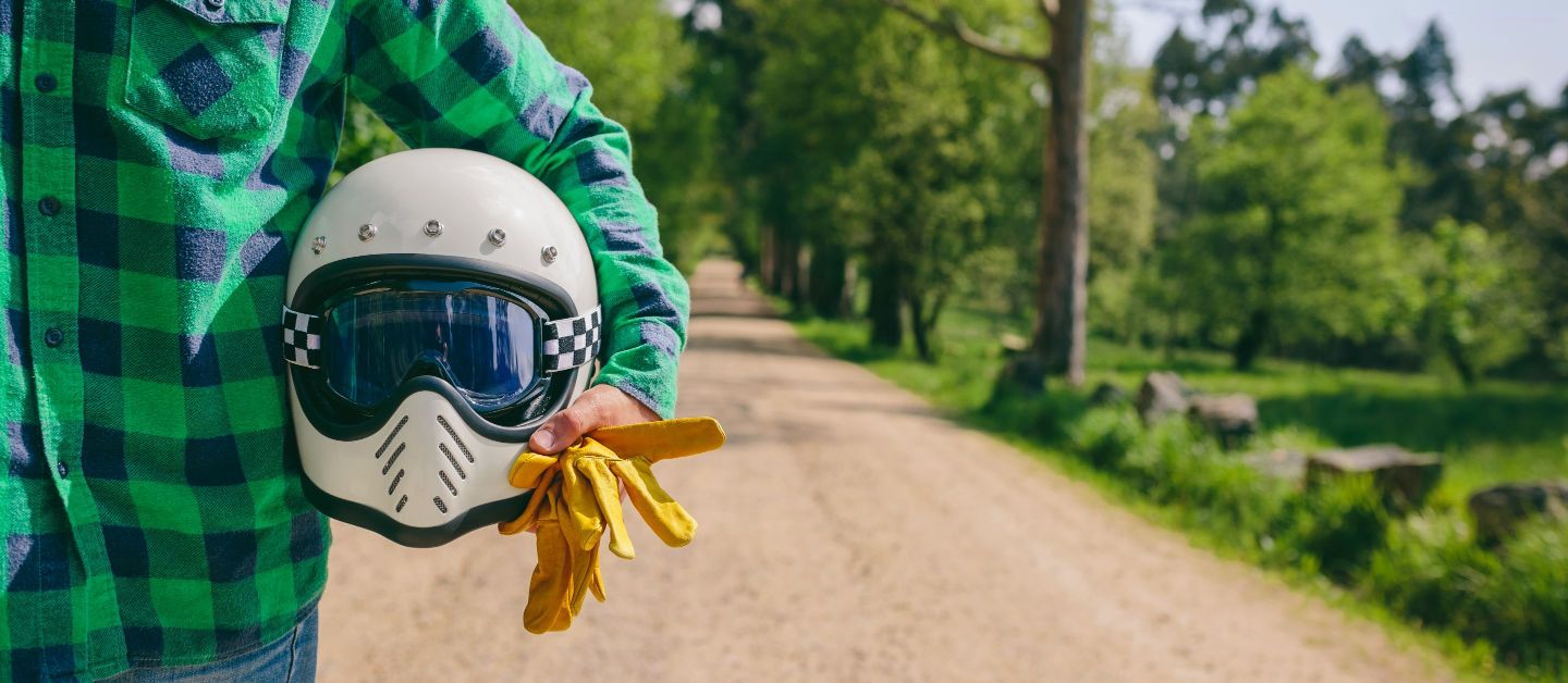 Man holding his motorcycle helmet