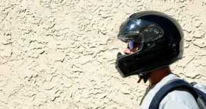 Man wearing an approved motorcycle helmet