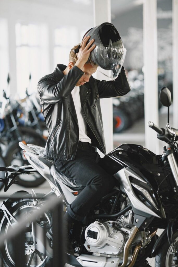 Young man putting his helmet